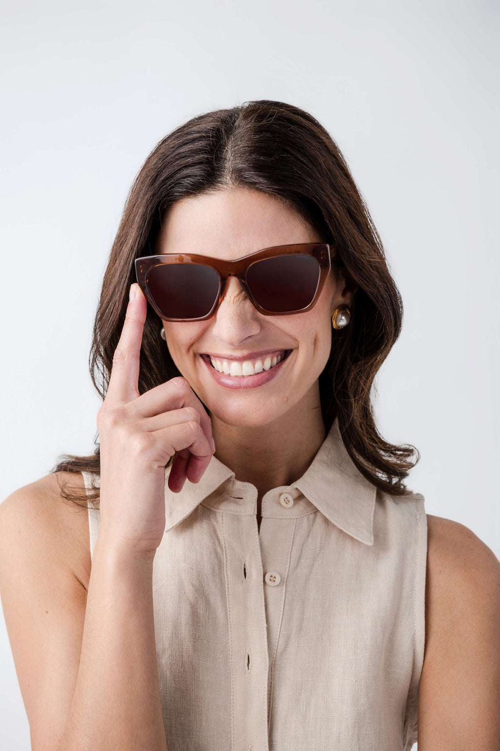 Brown cat-eye sunglasses with full cat-eye shape and amber tinted lenses