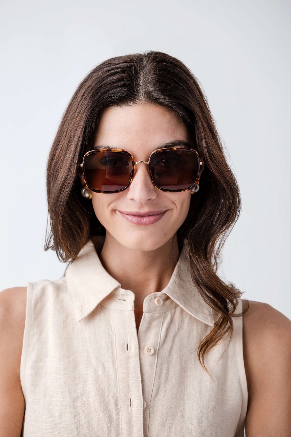 Square sunglasses with dark tortoise frames and brown gradient lenses, gold-tone hinges