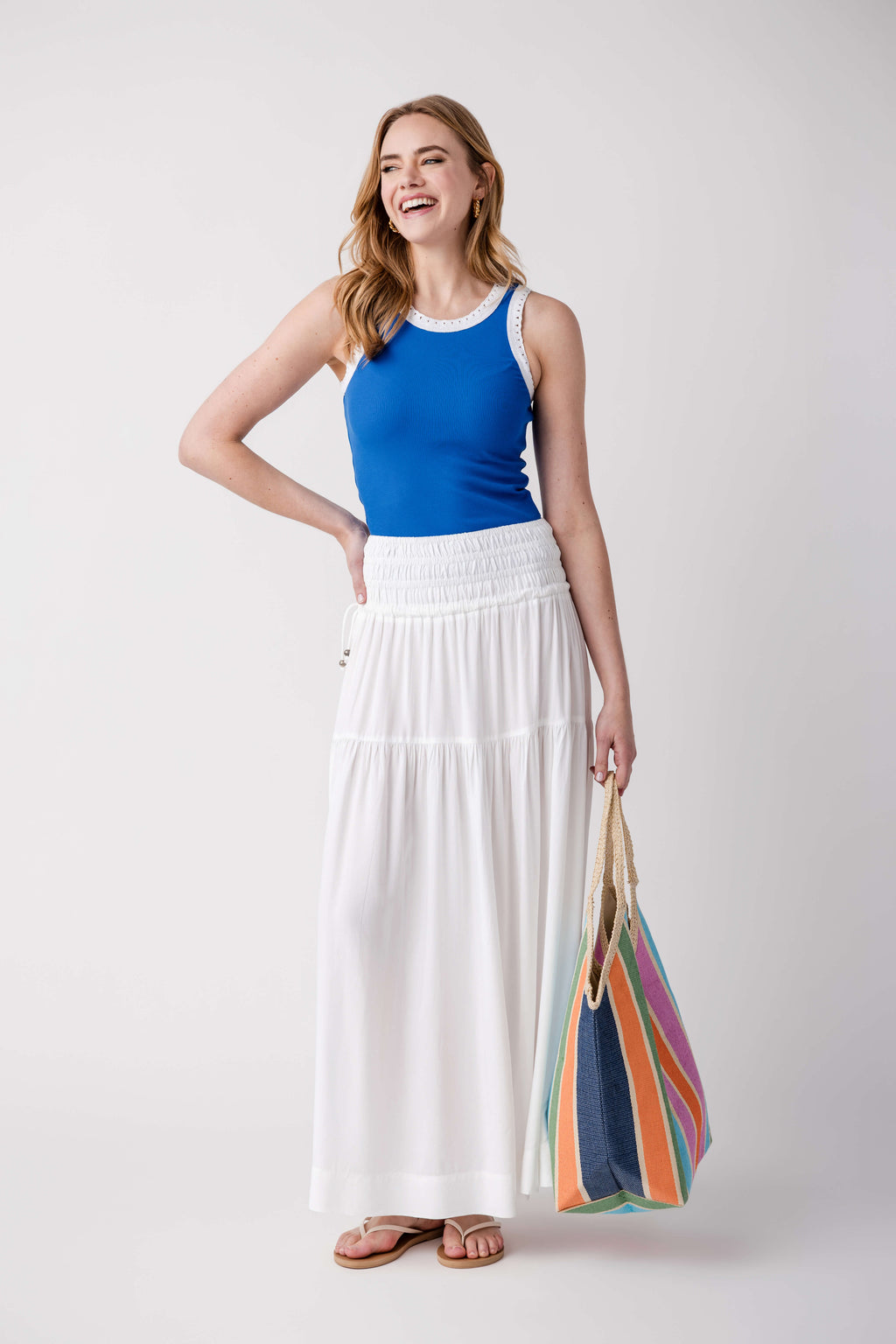 Blue ribbed scoop-neck tank with eyelet trim at neckline, sleeveless