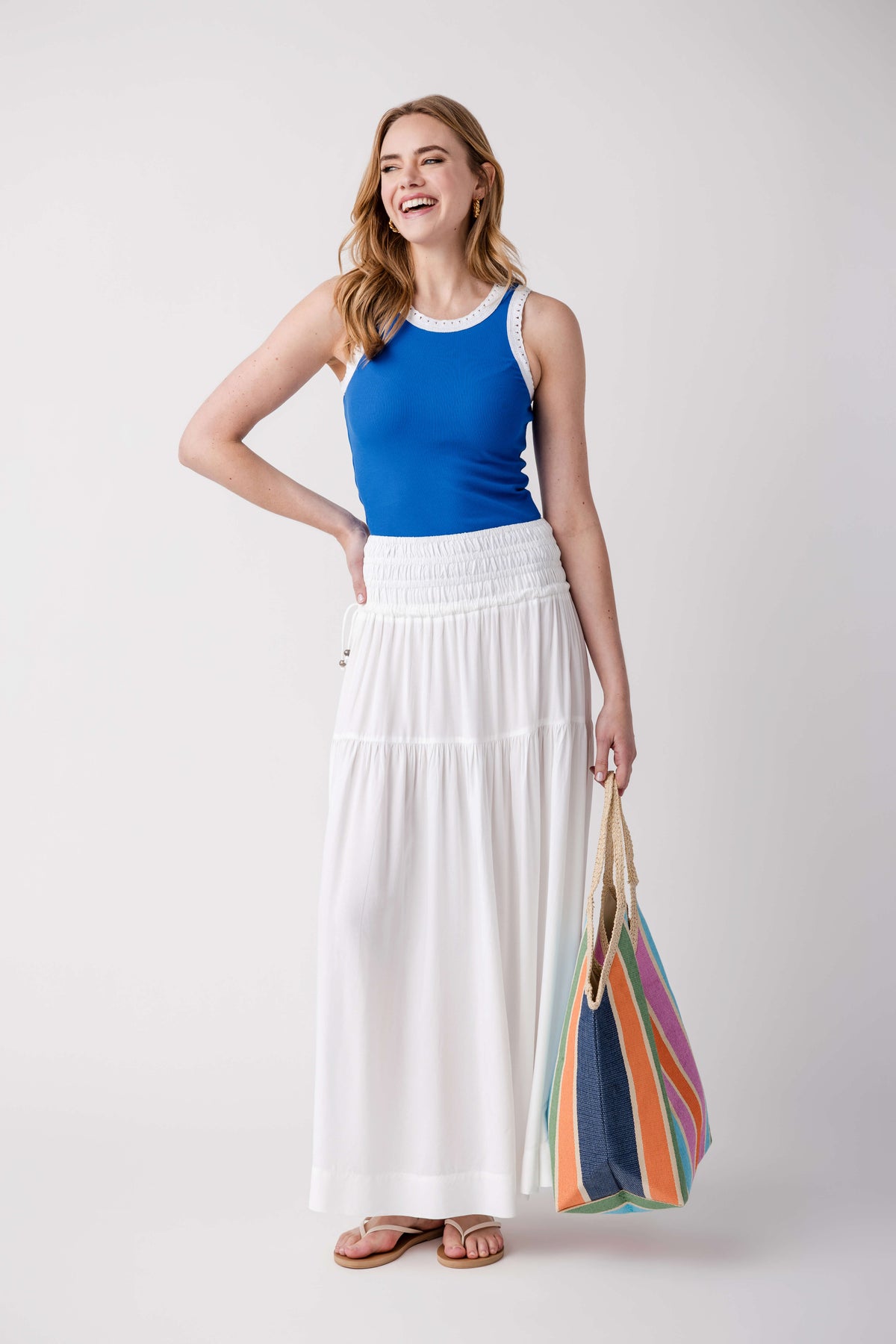 Blue ribbed scoop-neck tank with eyelet trim at neckline, sleeveless