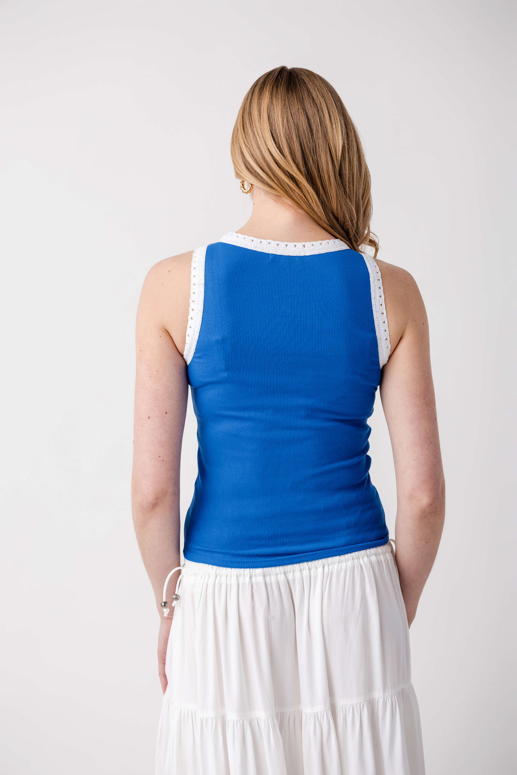 Back view of blue ribbed sleeveless tank with eyelet-trim neckline