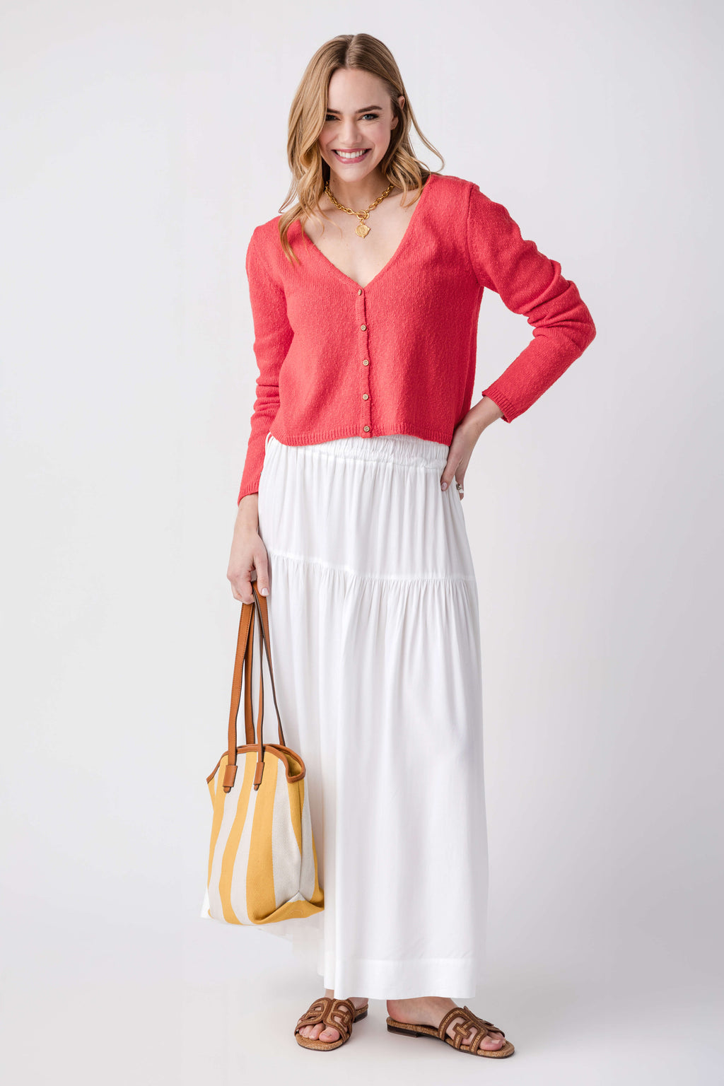 Tomato red V-neck cardigan with button front, long sleeves, and relaxed fit