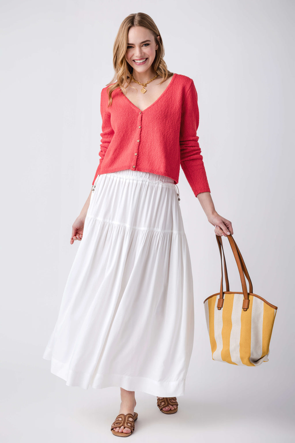 Tomato red cardigan sweater with V-neck and button front, full length view