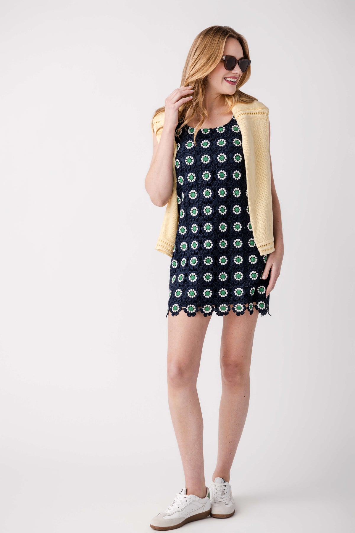 Navy sleeveless mini sun dress with green dot print and scalloped crochet hem