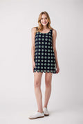 Navy sleeveless mini dress with green dot pattern and crochet lace edging
