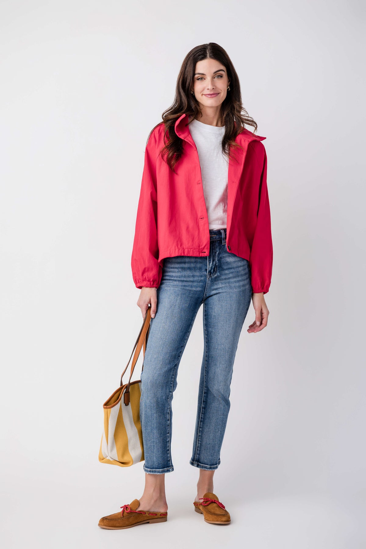 Medium wash straight-leg jeans featuring non-distressed seams and cropped ankle hem.