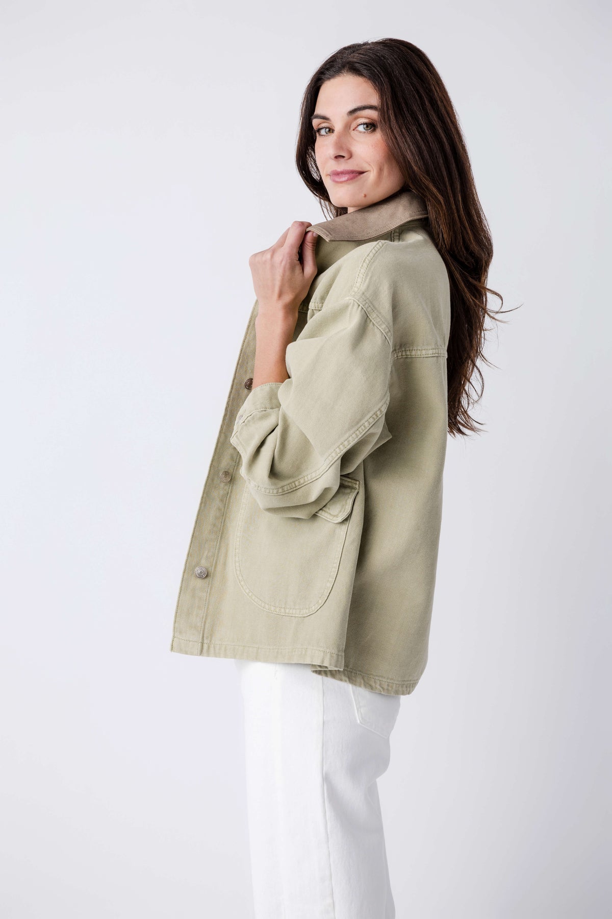 Washed sage denim jacket with point collar and button cuffs, side view