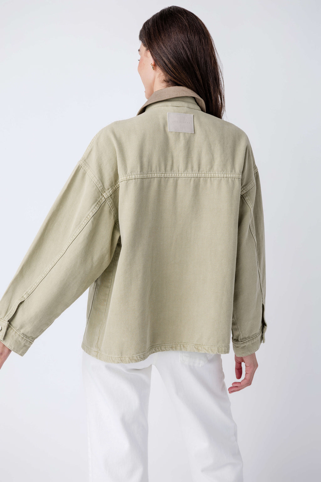 Washed sage denim jacket with back yoke seam and point collar, rear view