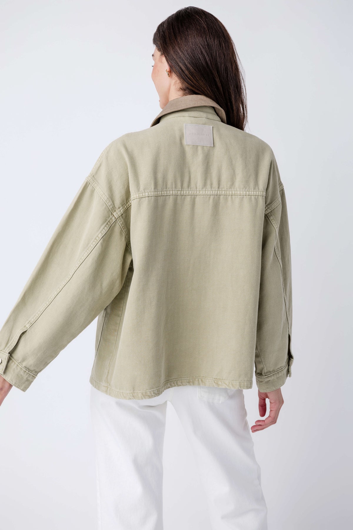 Washed sage denim jacket with back yoke seam and point collar, rear view