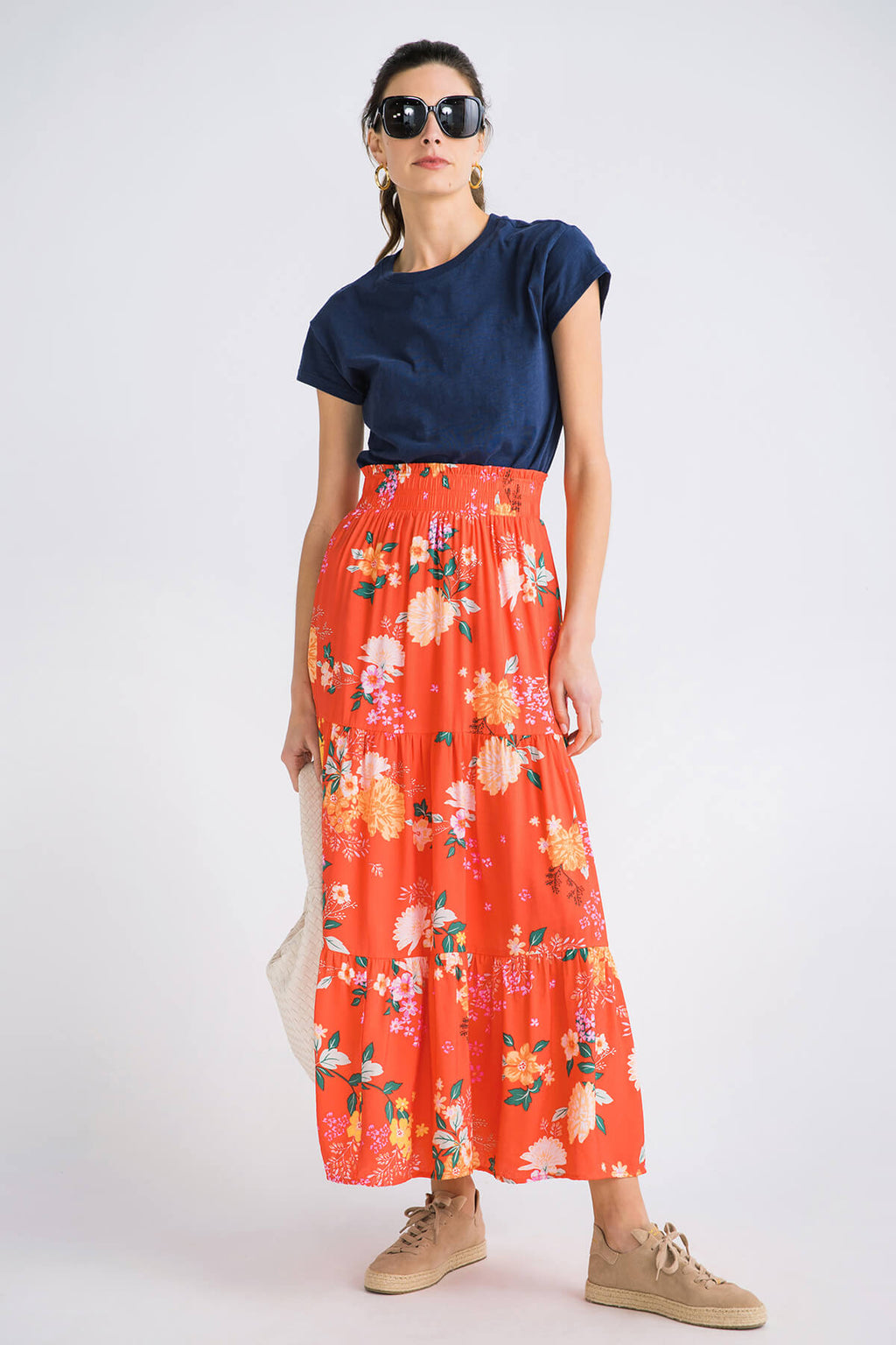 Navy modern slub tee with short sleeves and round neckline, worn with an orange floral skirt