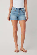 Medium-wash high-rise denim shorts with button fly, front patch pockets, frayed hem
