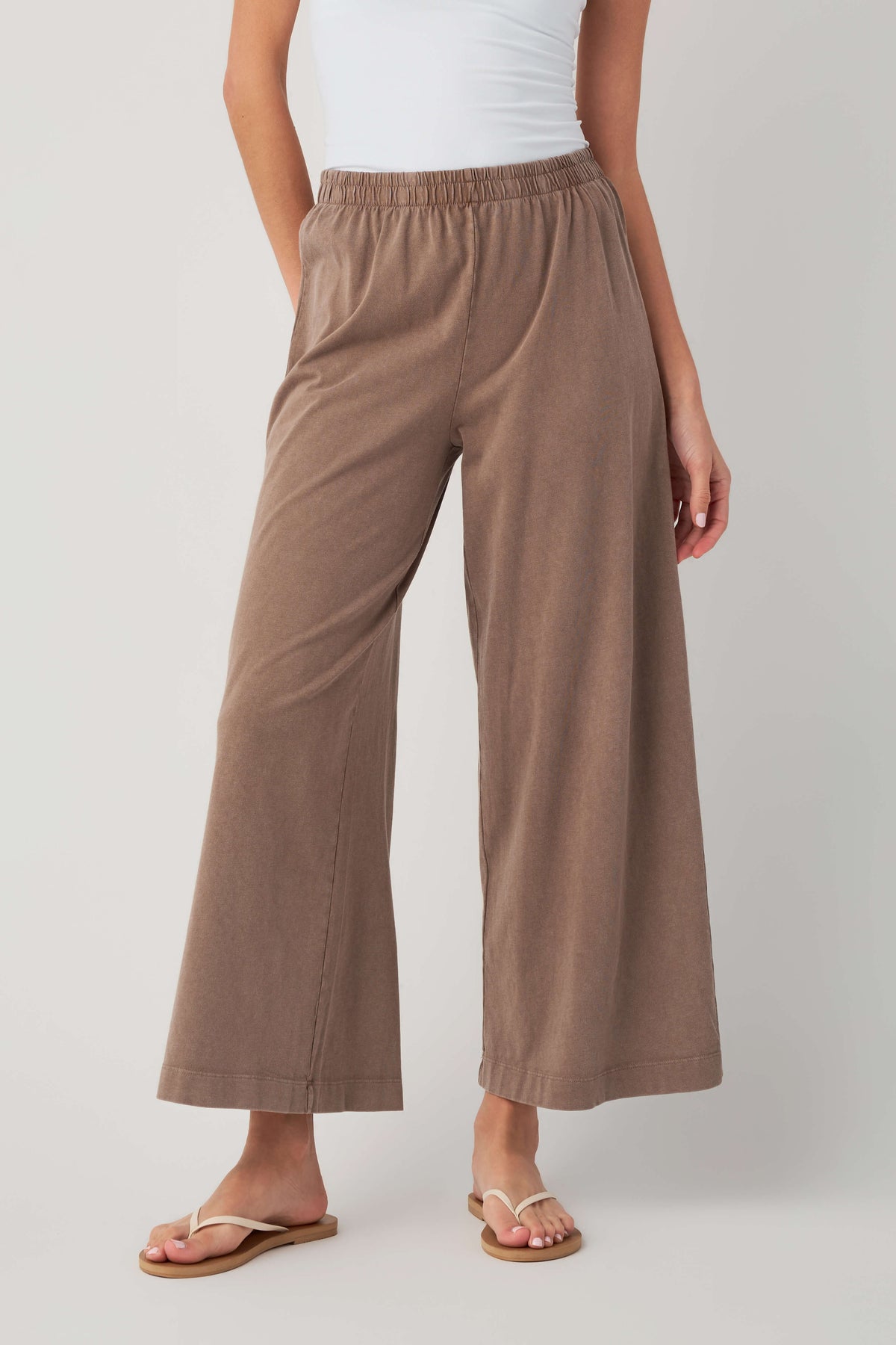 Taupe jersey crop flare pants with elastic waistband and wide leg