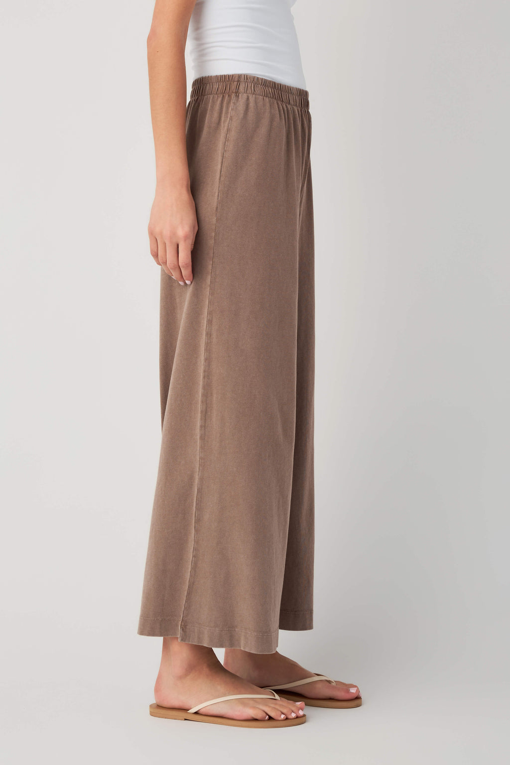 Taupe jersey crop flare pants, side view, elastic waistband and wide leg