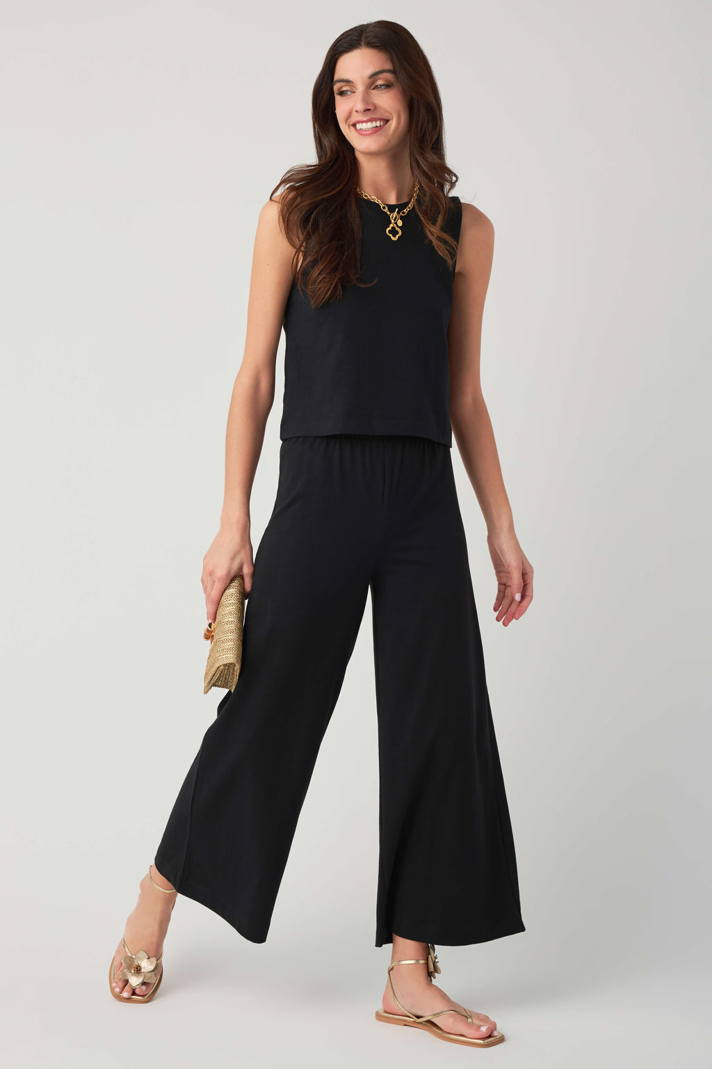 Jersey crop flare pants in true black, elastic waist with wide flared hem.