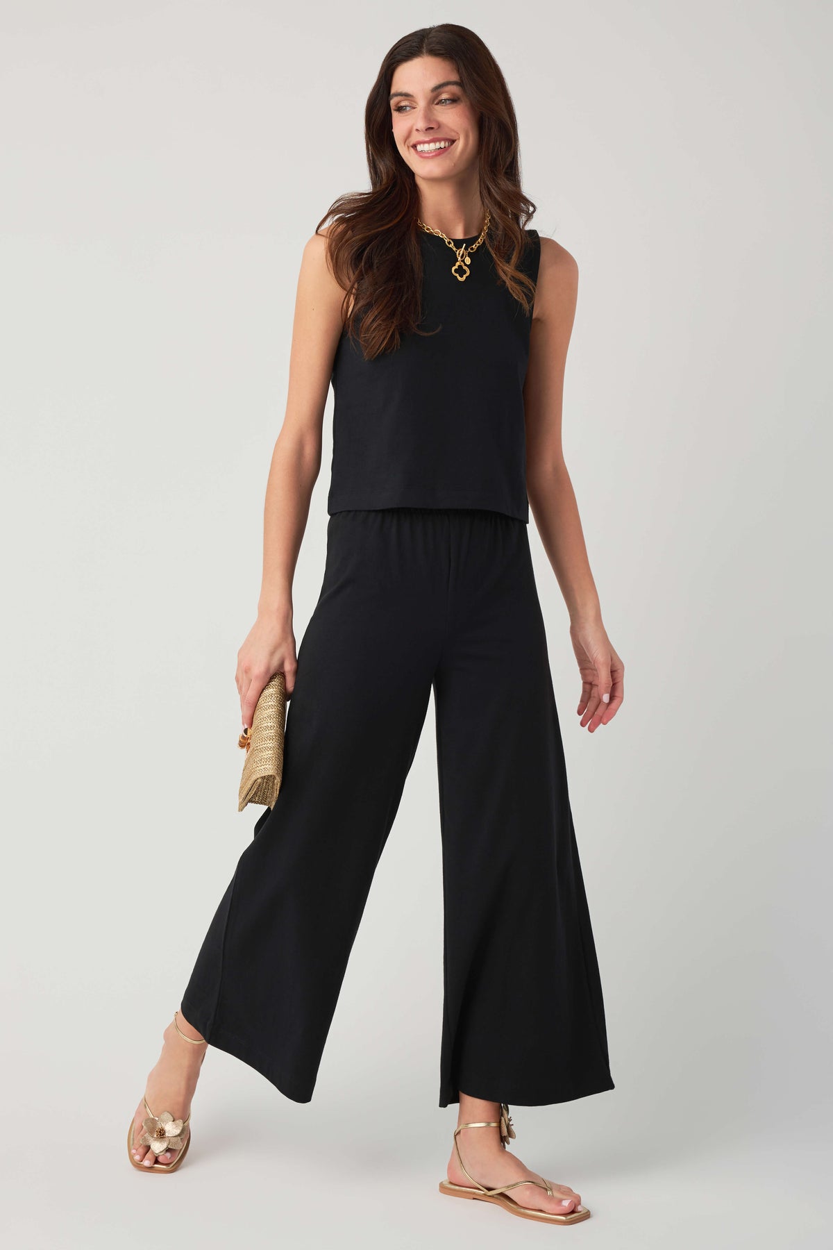 Jersey crop flare pants in true black, elastic waist with wide flared hem.