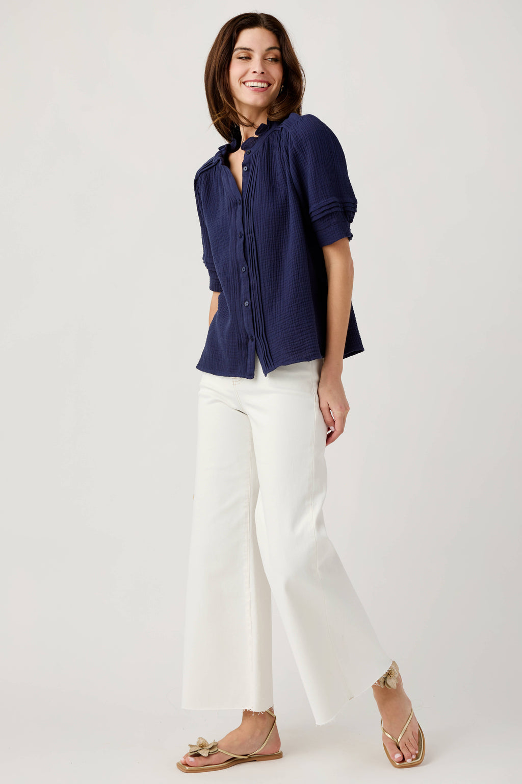 Navy gauze short sleeve top with ruffled collar and button placket