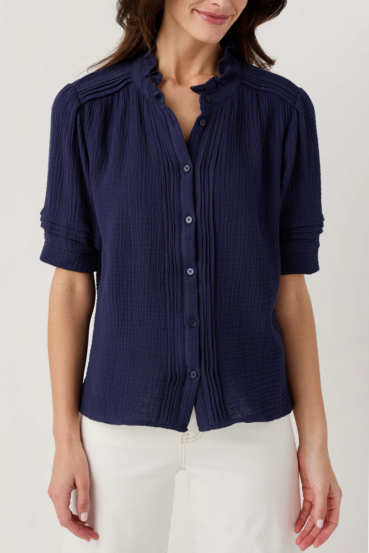 Navy gauze short sleeve top with button front and ruffled collar details