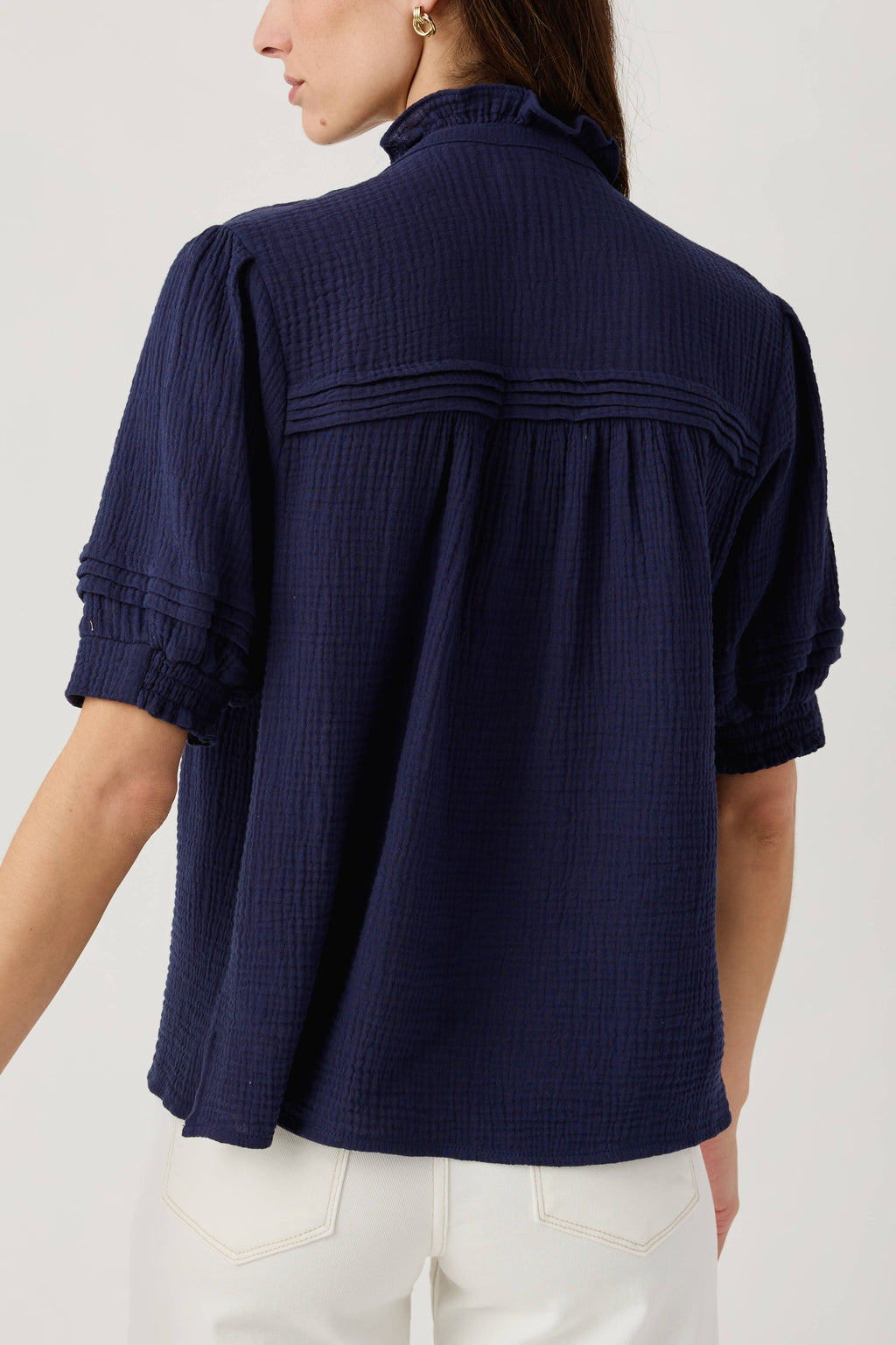 Navy gauze short sleeve top, back view with gathered yoke and elastic sleeve cuffs