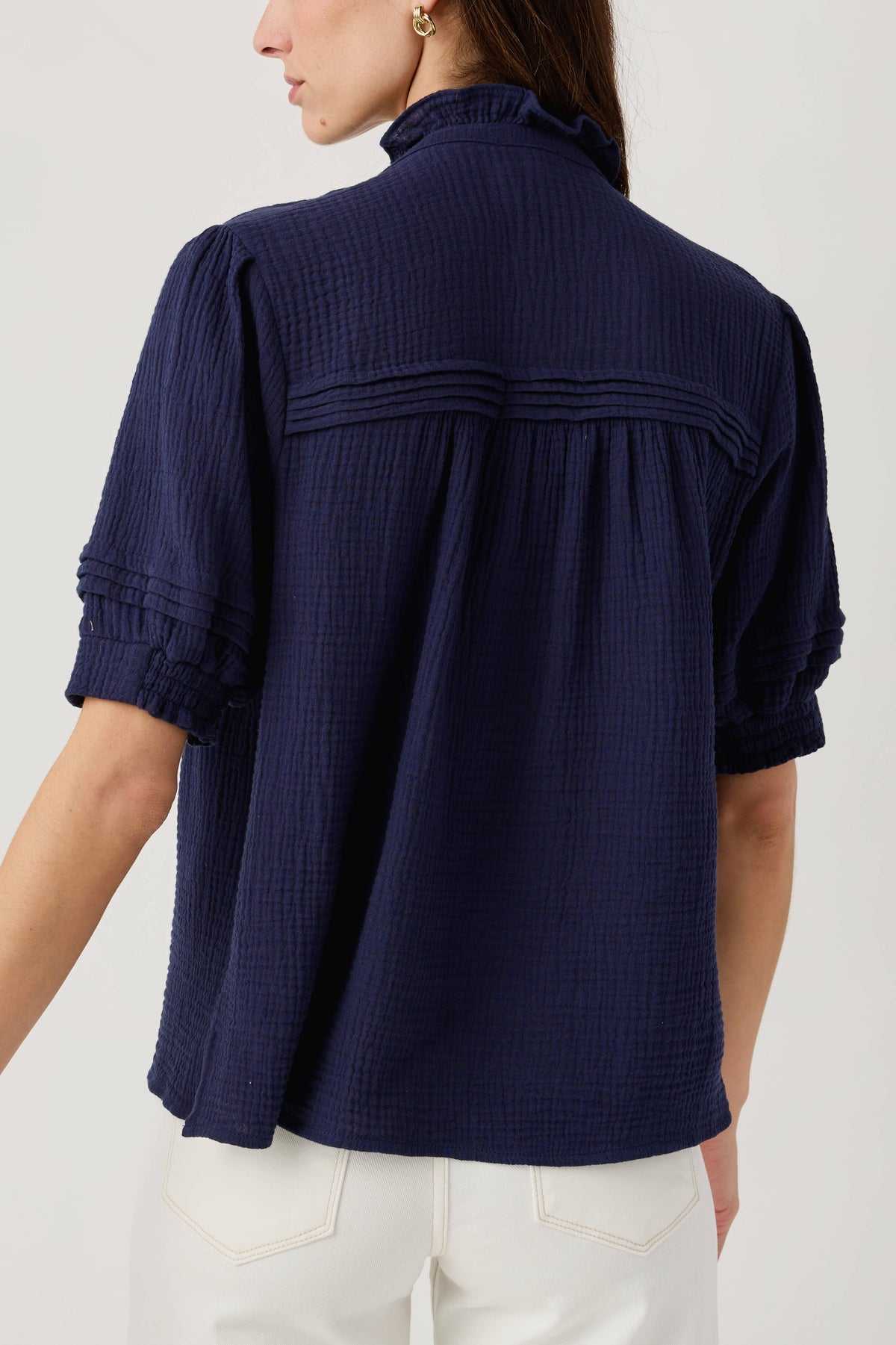 Navy gauze short sleeve top, back view with gathered yoke and elastic sleeve cuffs