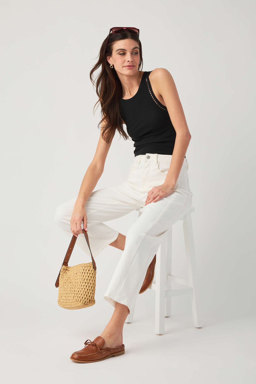 Black ribbed sleeveless tank with contrast trim on racerback and armholes