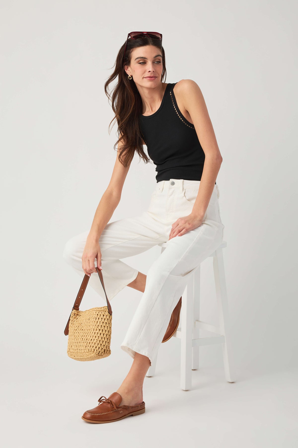 Black ribbed sleeveless tank with contrast trim on racerback and armholes