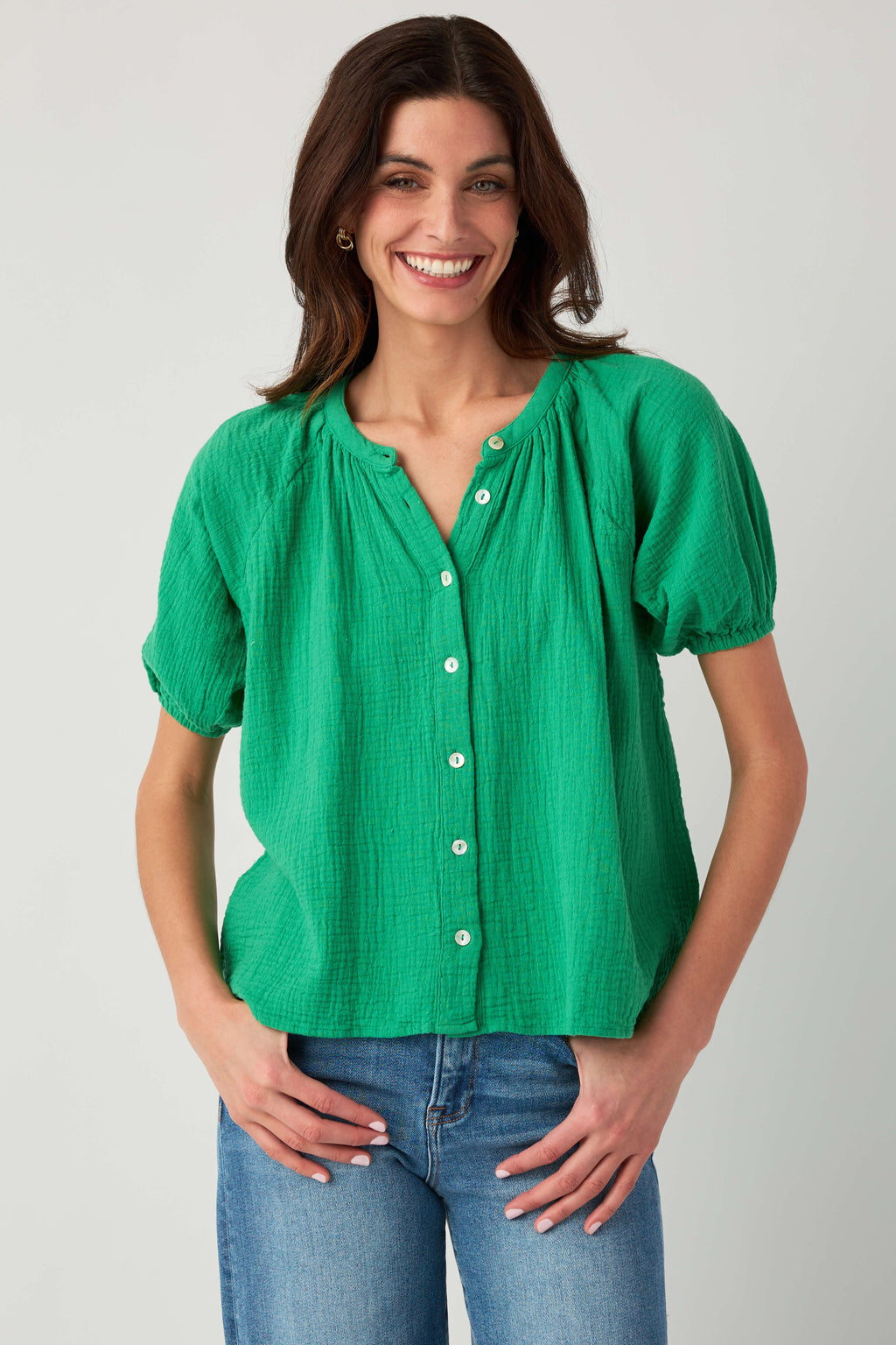 Kelly green gauze button-up top with three-button front and gathered puff sleeves