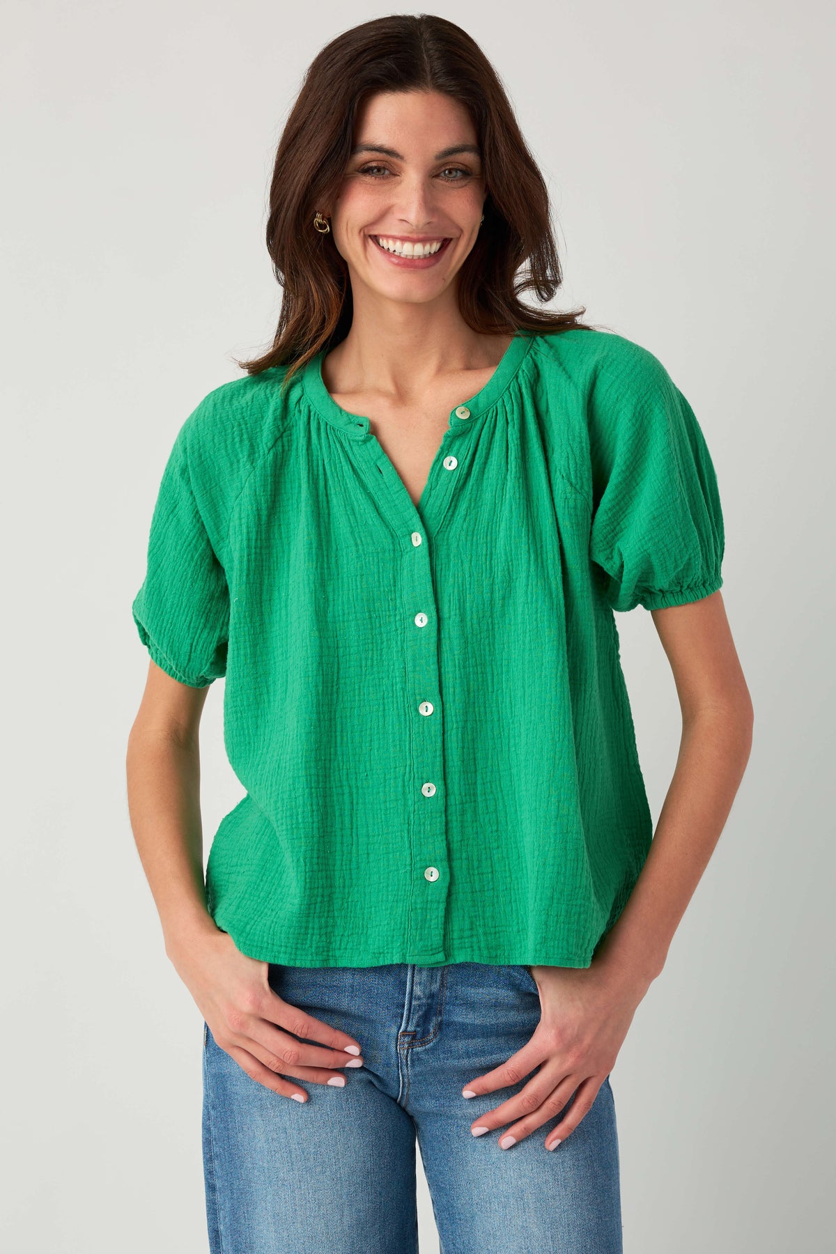 Kelly green gauze button-up top with three-button front and gathered puff sleeves