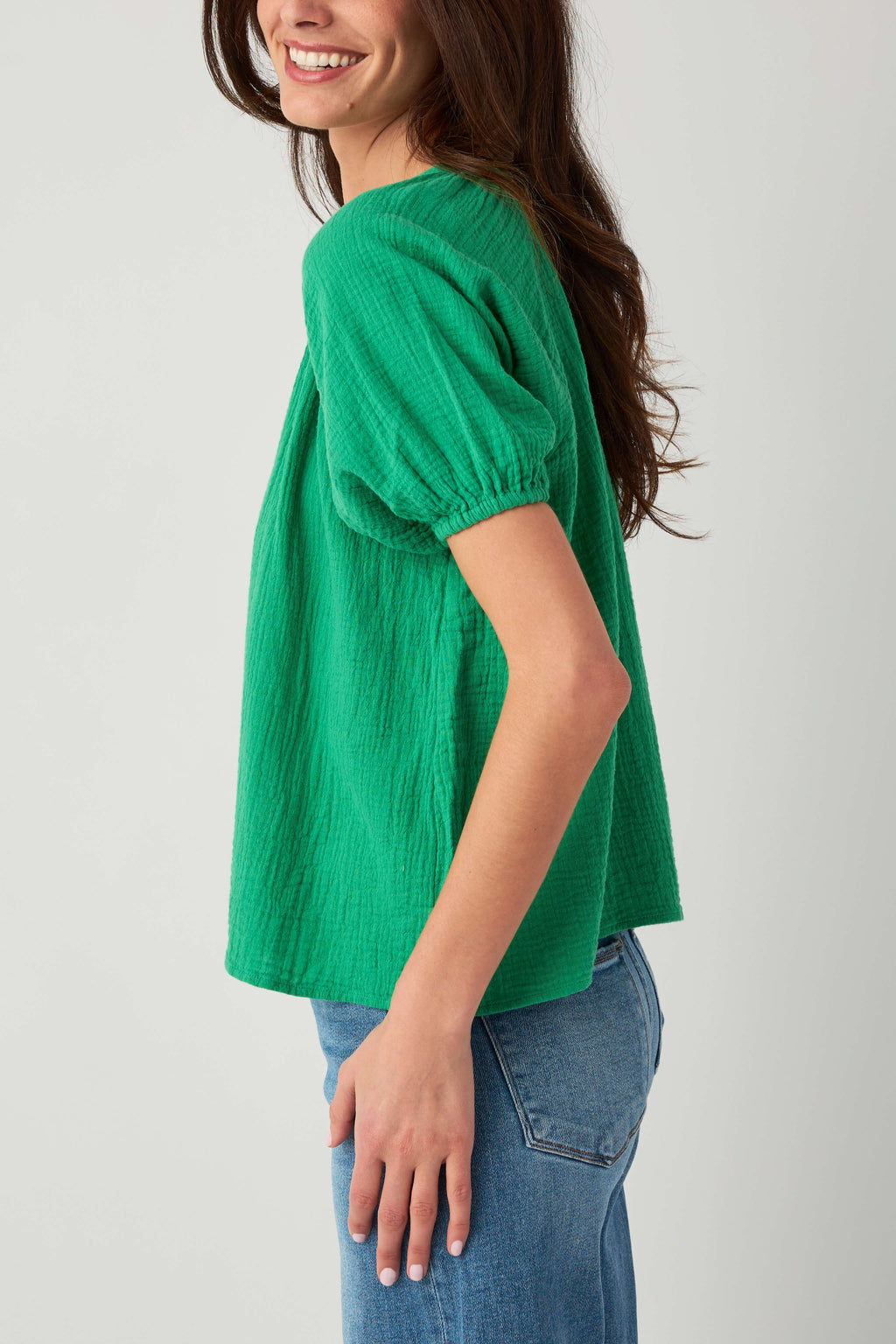Kelly green gauze button-up top with short puff sleeves and button front detail