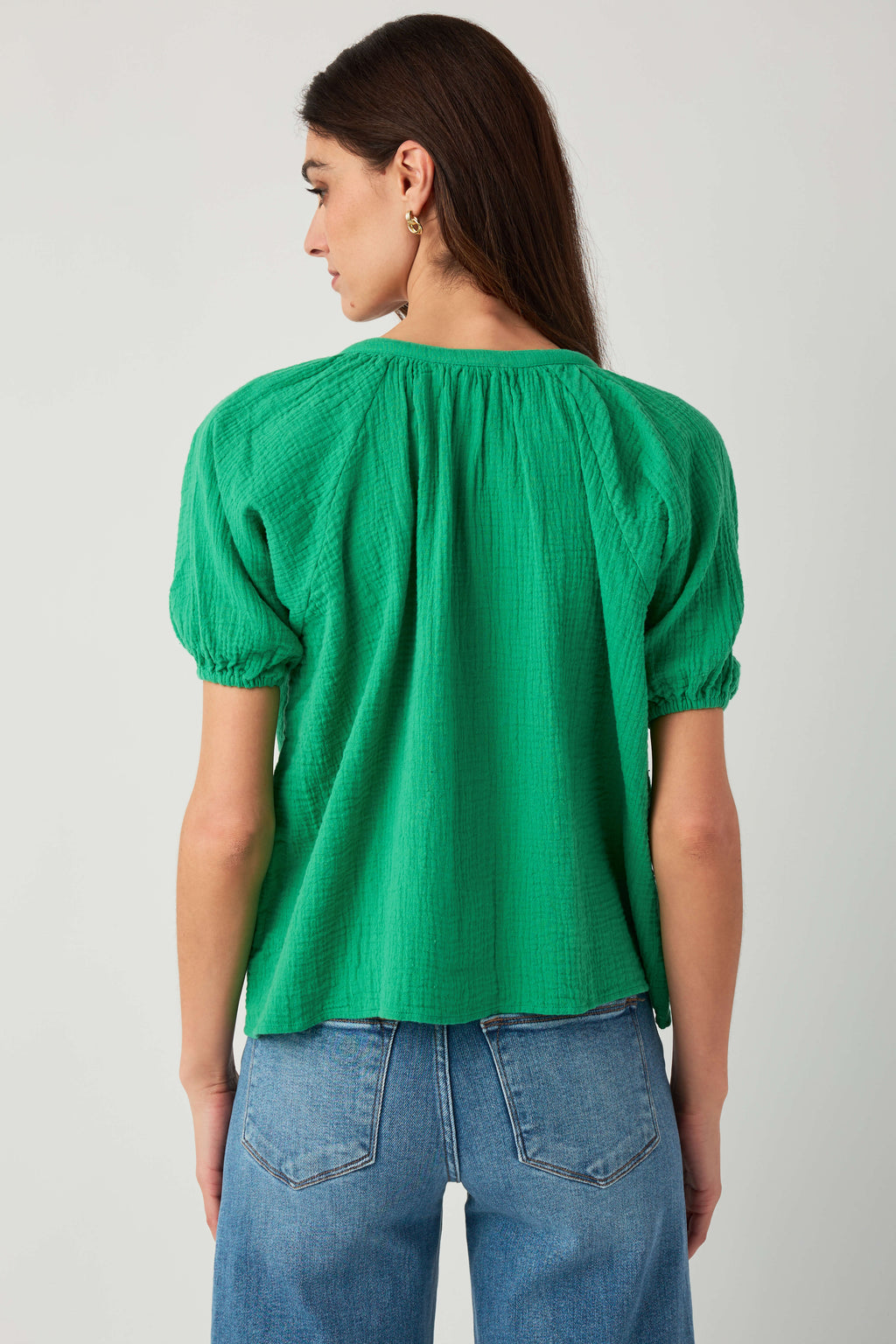 Kelly green gauze button-up top back view with gathered yoke and elastic sleeves