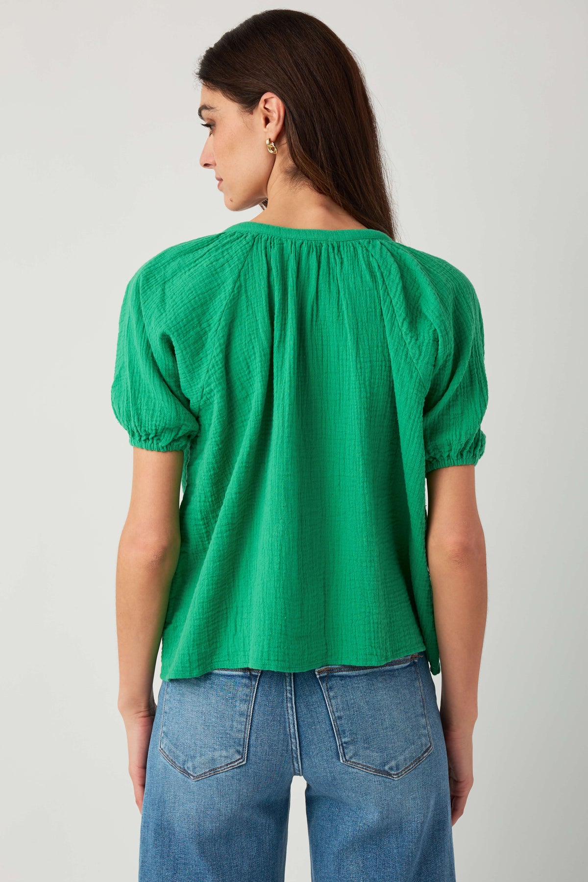 Kelly green gauze button-up top back view with gathered yoke and elastic sleeves