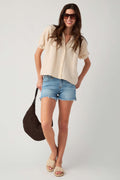 Natural gauze button-up top with three-button front and gathered neckline