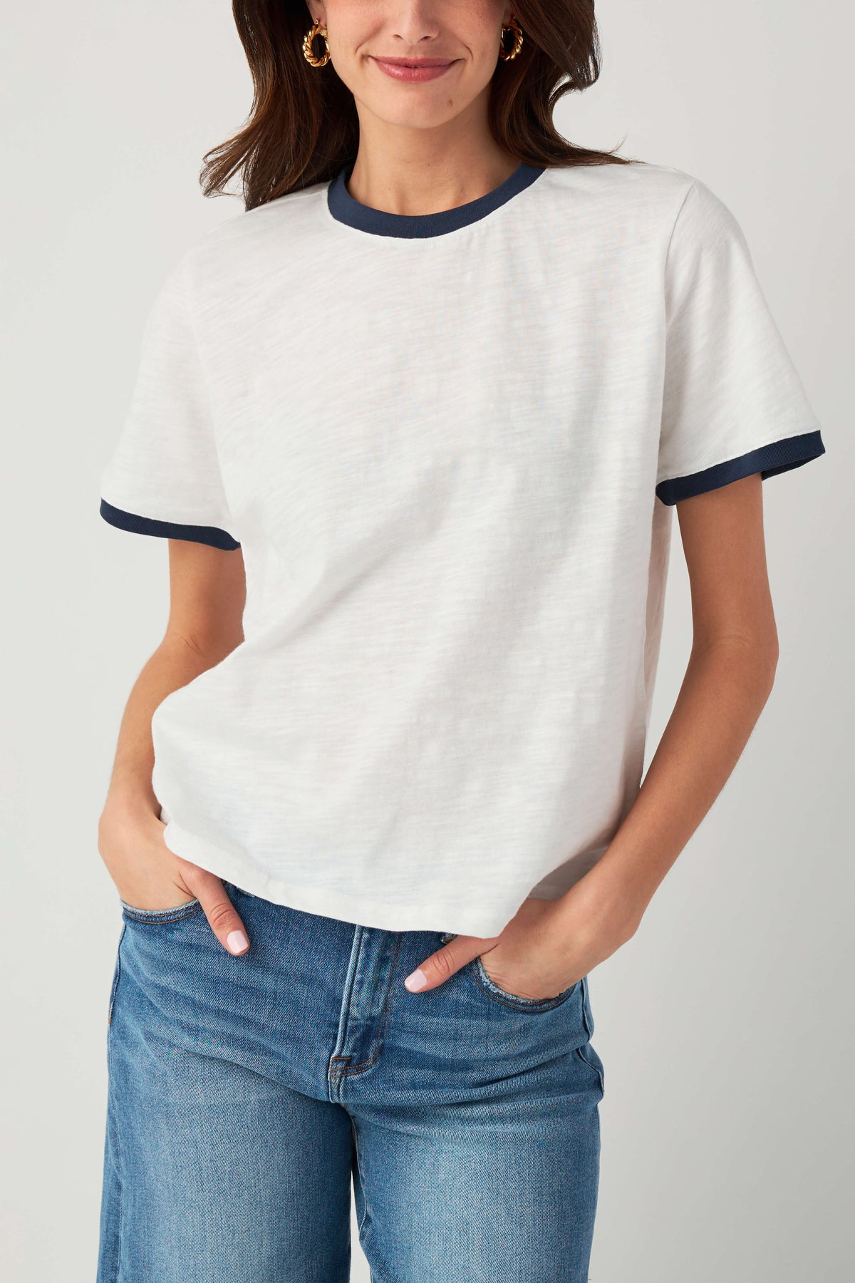 White slub ringer tee with navy trim, short sleeves and crew neckline