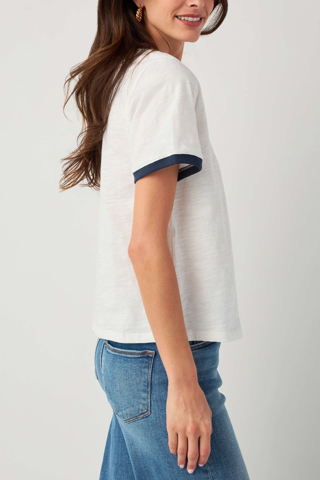 White slub ringer tee with navy trim, side view short sleeves and hem