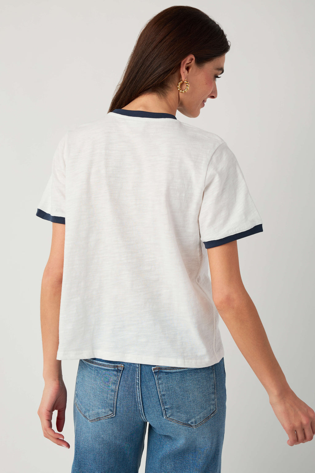 White slub ringer tee with navy trim, back view crew neckline and sleeves