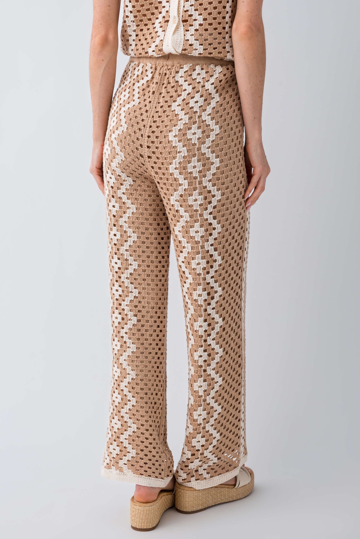Natural crochet pants detail view: vertical zigzag motifs and straight wide leg