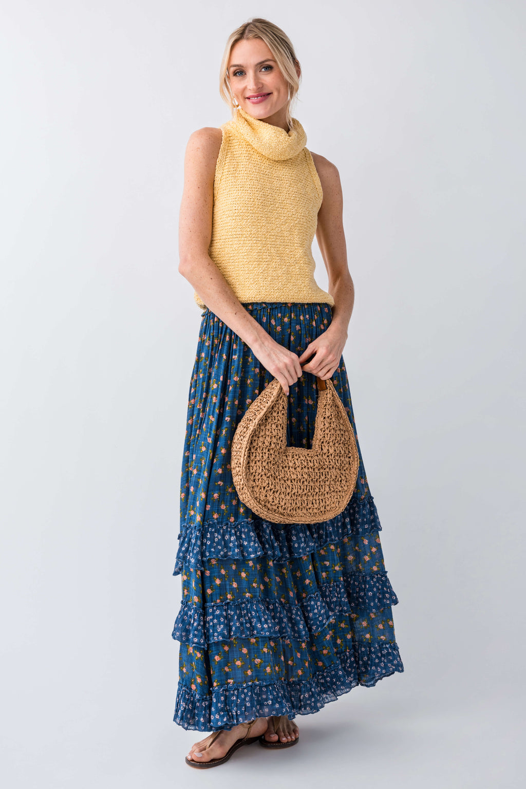 Yellow sleeveless knit turtleneck top with textured fabric and high neckline