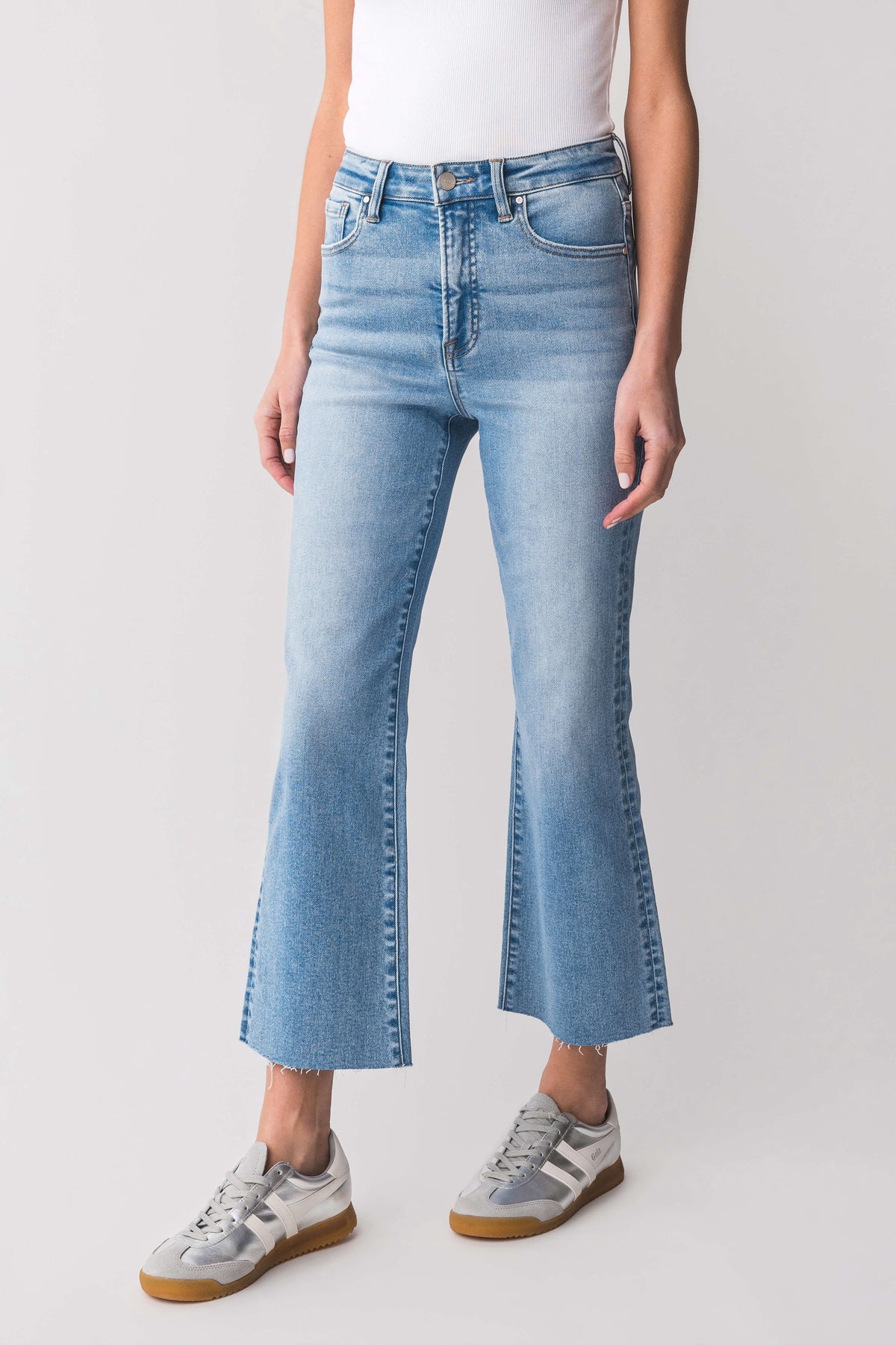 High-rise kick flare jeans in medium blue wash with classic front pockets