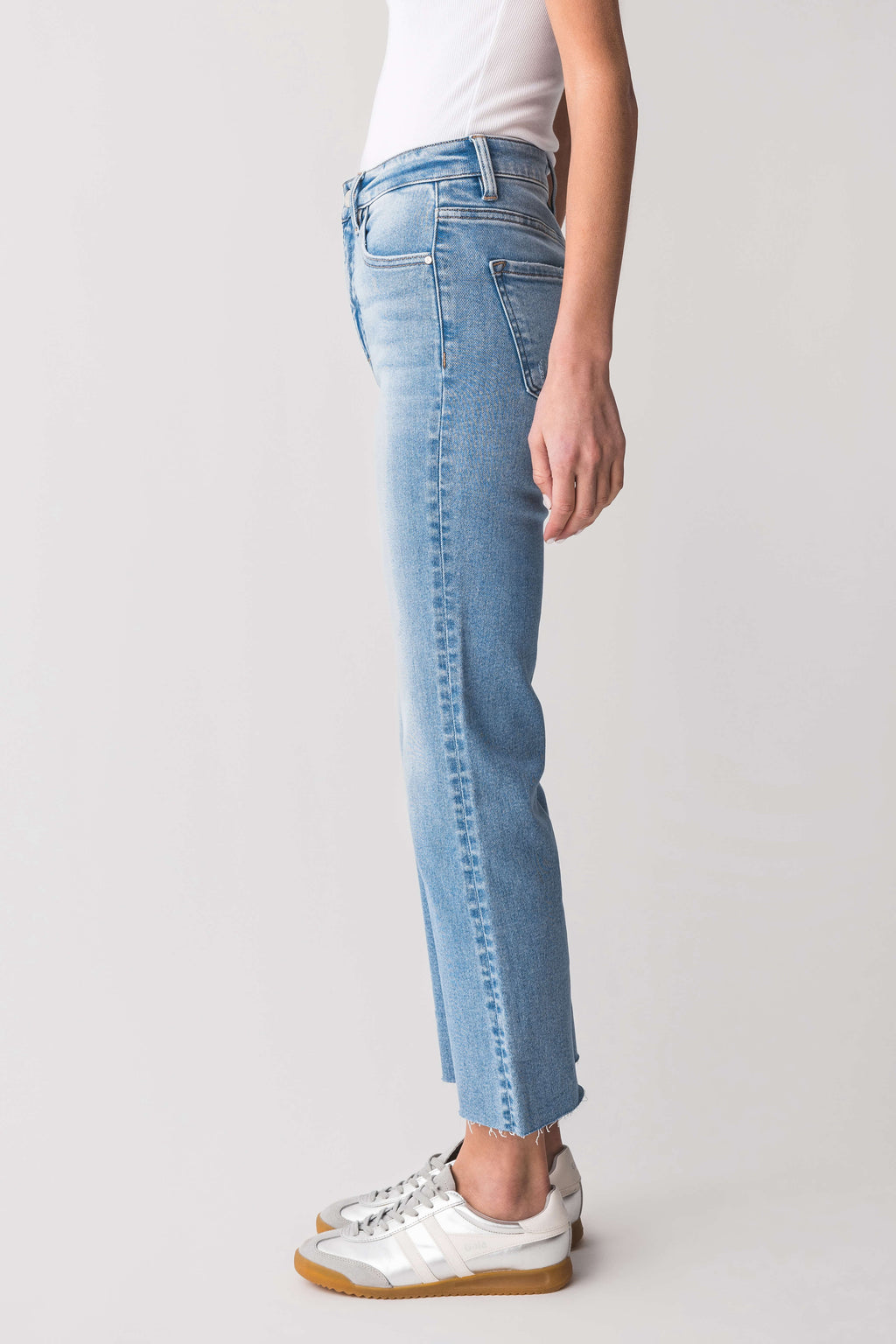 High-rise kick flare jeans in light-wash blue, side view with cuffed straight hems.