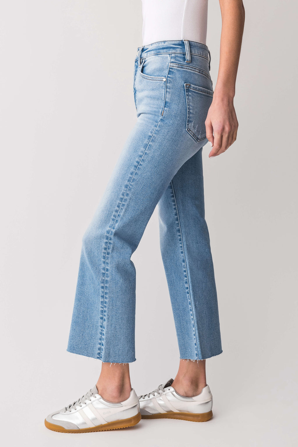 High-rise kick flare jeans in light-wash blue, front angled view with five-pocket styling.
