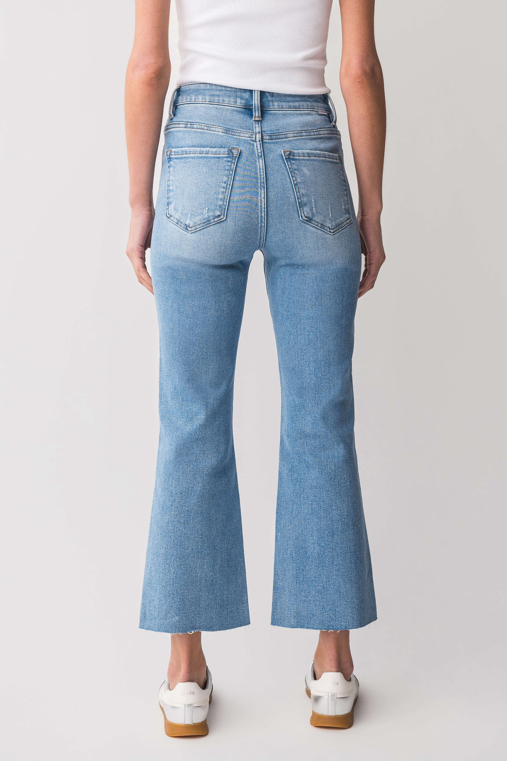 High-rise kick flare jeans in light blue wash with front pockets and stitched seams
