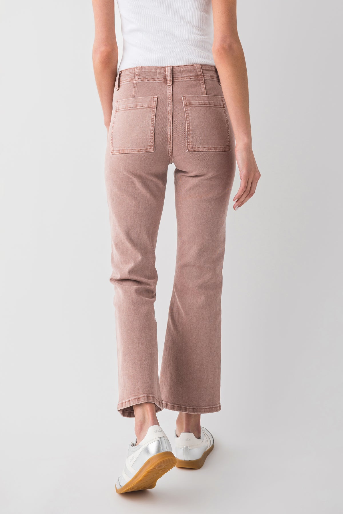 Mauve ankle flare jeans, back view with patch pockets and curved yoke seam