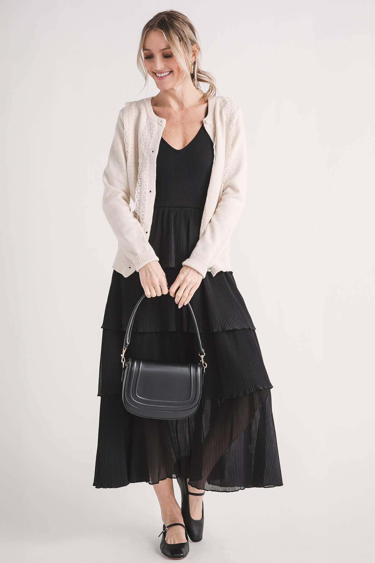 Dark tube strap with silver-tone lobster clasps on mini crossbody bag