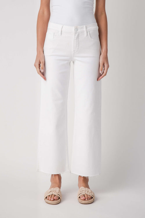 White mid-rise straight jeans with raw ankle hem and front pockets