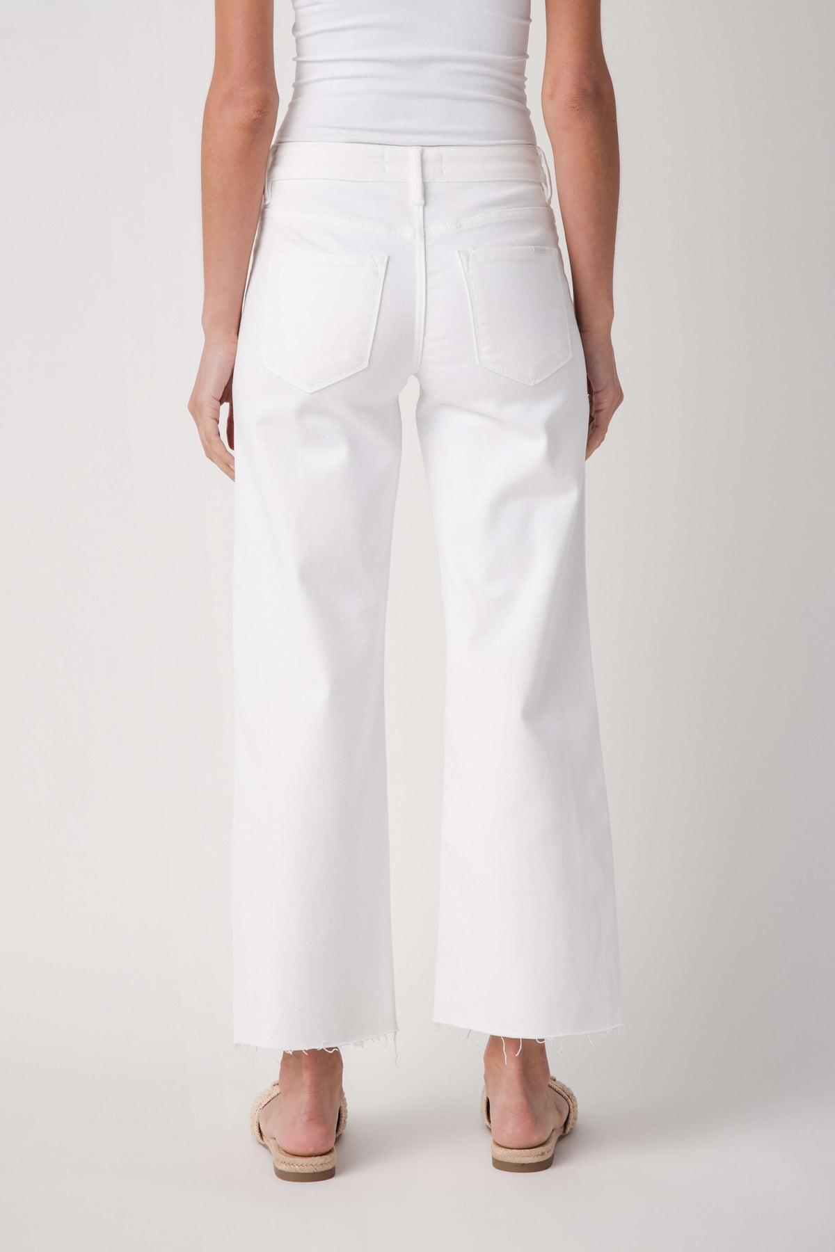 White mid-rise straight jeans with back yoke and raw ankle hem