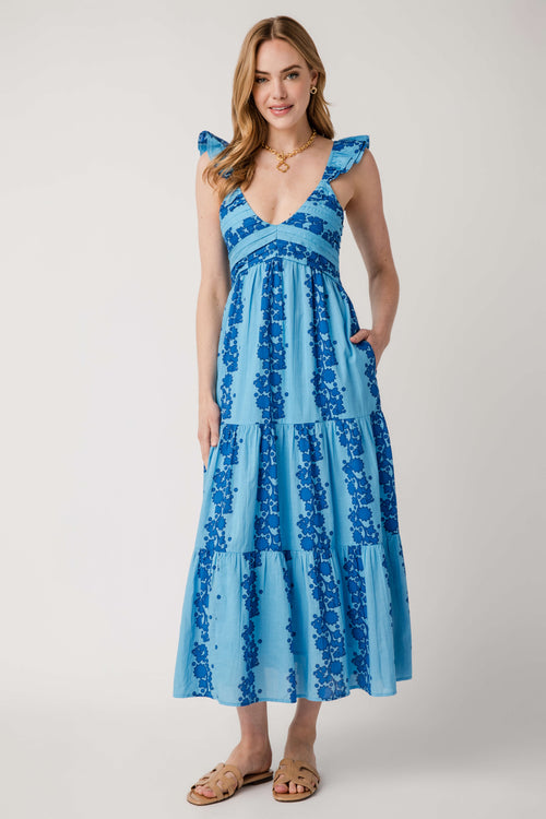 Blue V-neck tiered maxi dress, sleeveless with ruffled shoulders and tiered skirt