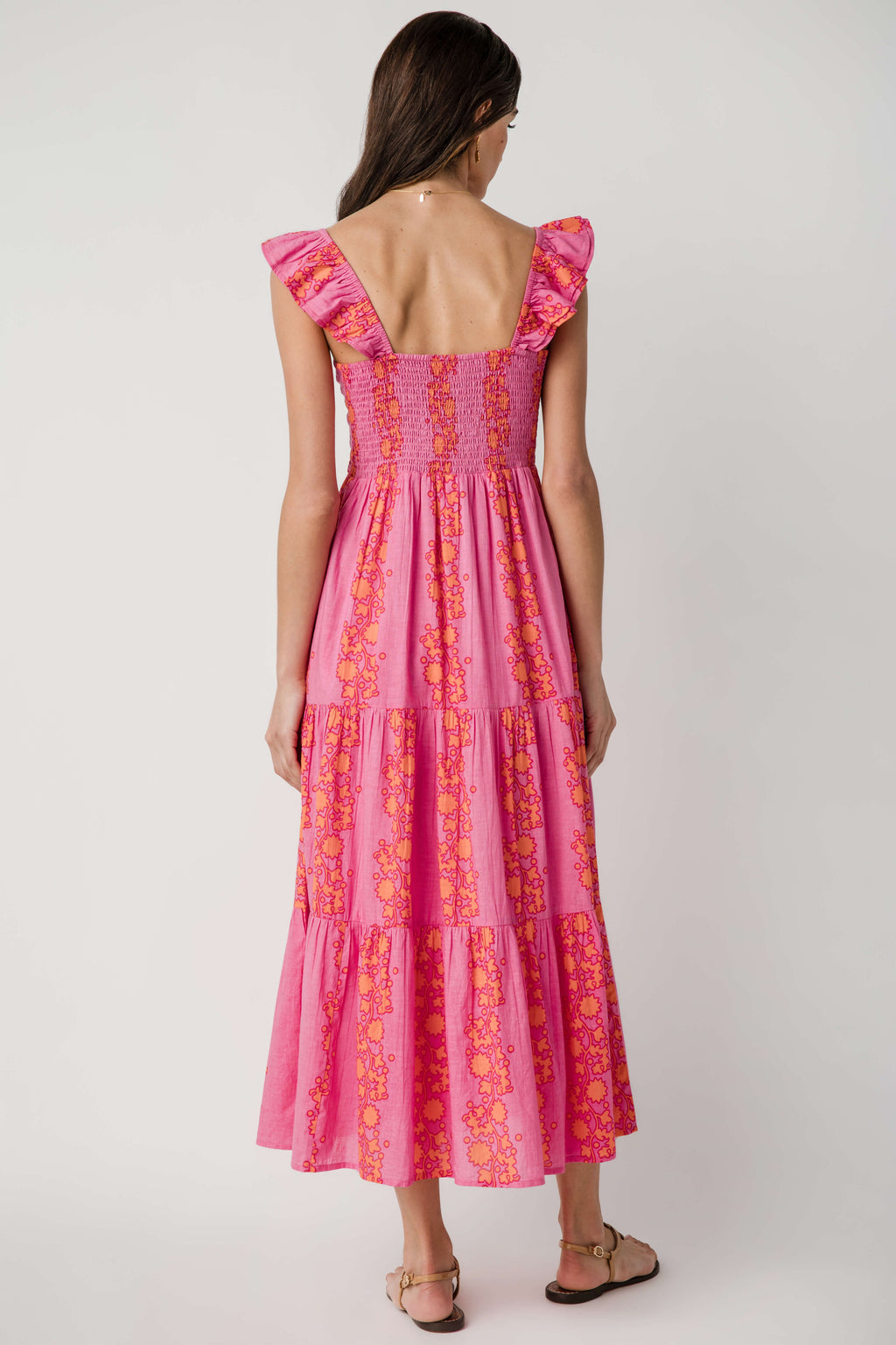 Pink tiered V-neck maxi dress with ruffled cap sleeves, back view