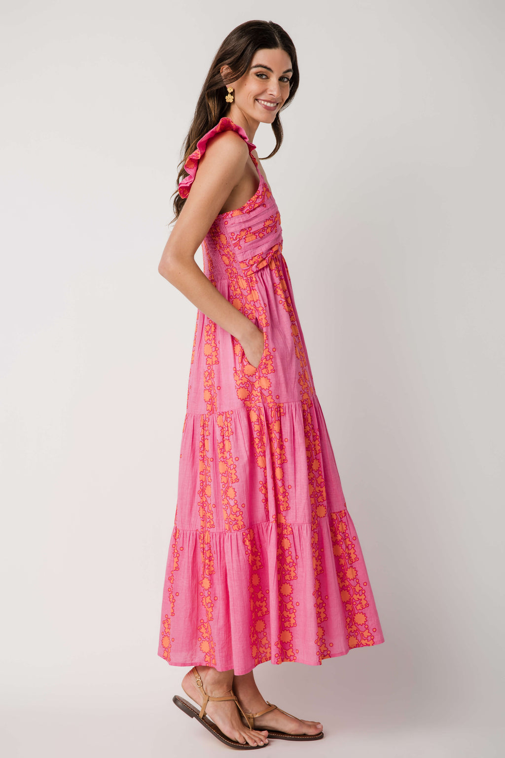 Pink tiered V-neck maxi dress with ruffled cap sleeves, side profile