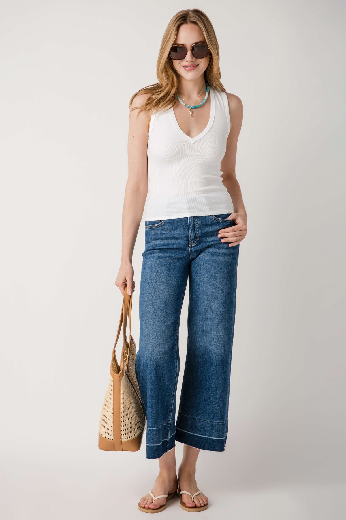 Dark blue high-rise wide-leg crop jeans with released hem, straight wide leg shape