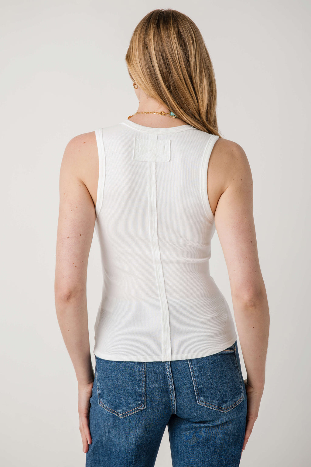 Ivory sleeveless tank top, scoop back with vertical center seam detail
