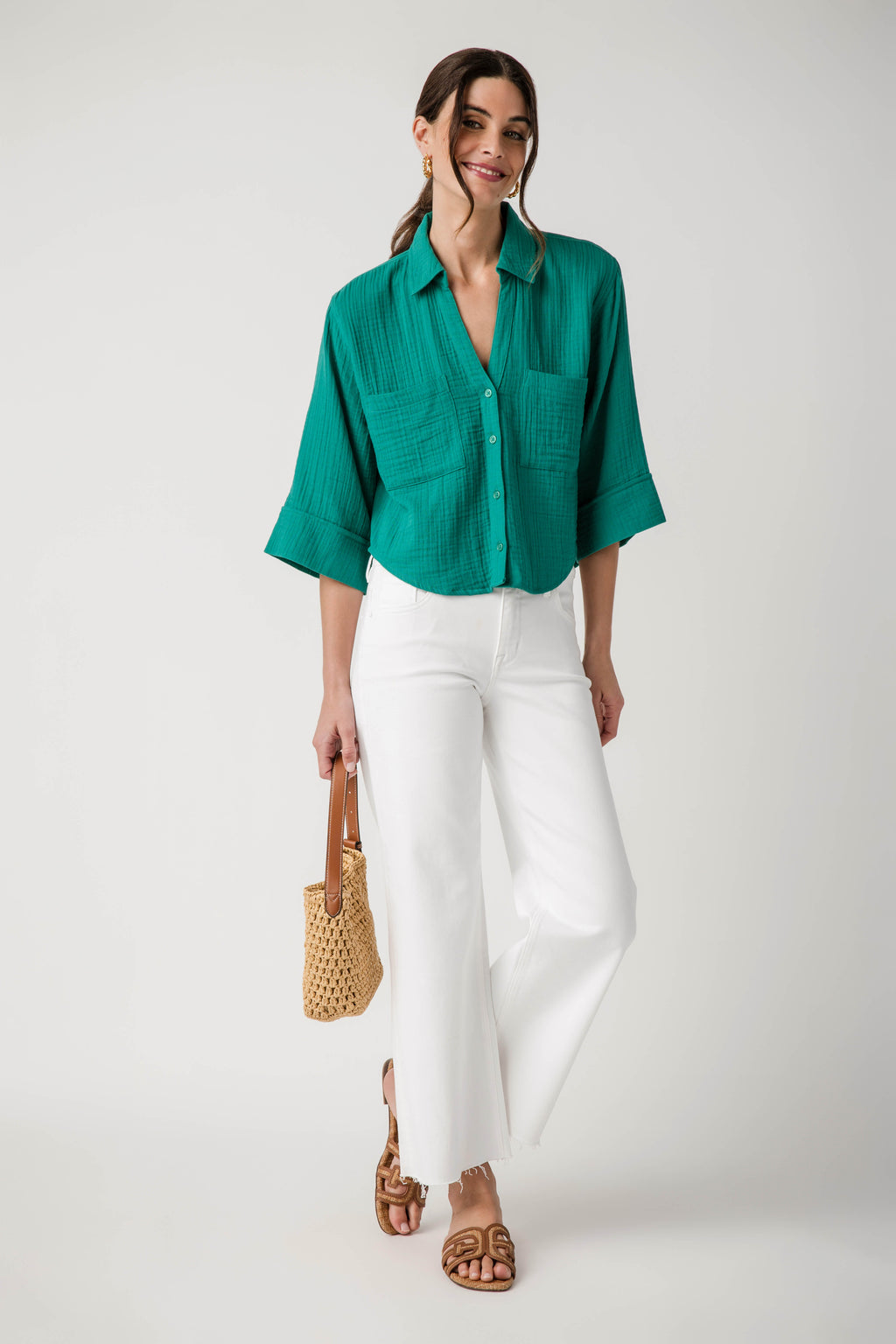 Rainforest green button-front blouse with chest pockets and three-quarter rolled sleeves